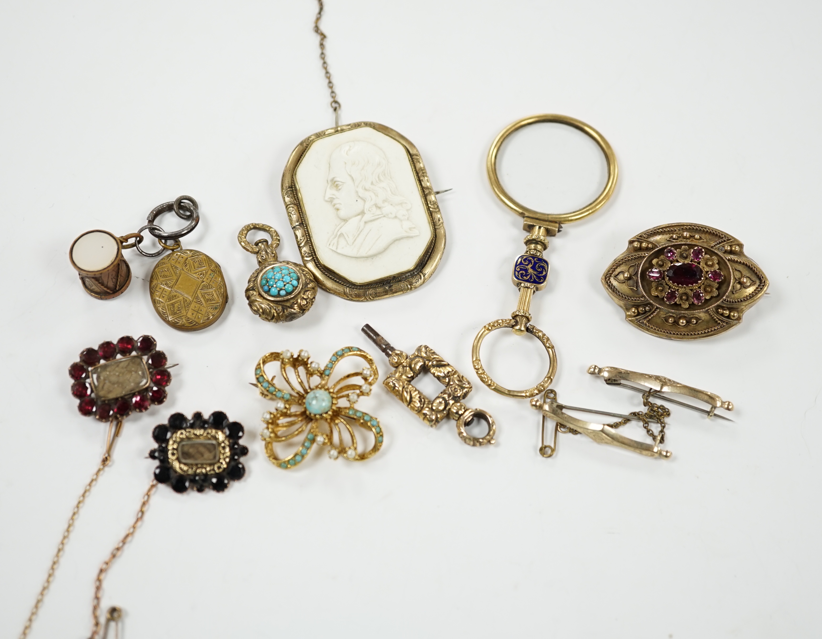Two Georgian yellow metal mourning brooches, including garnet set and other items including garnet set brooch, watch key, eye glass, paste brooch, etc.